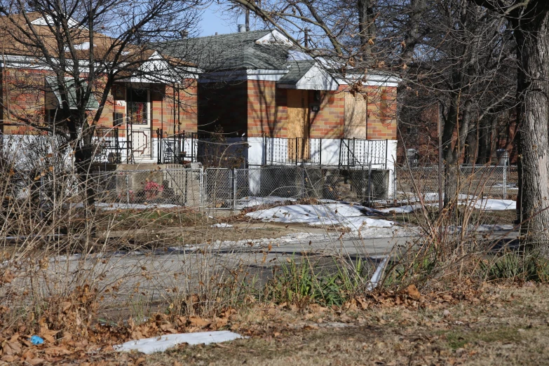 this is an old abandoned house with red brick