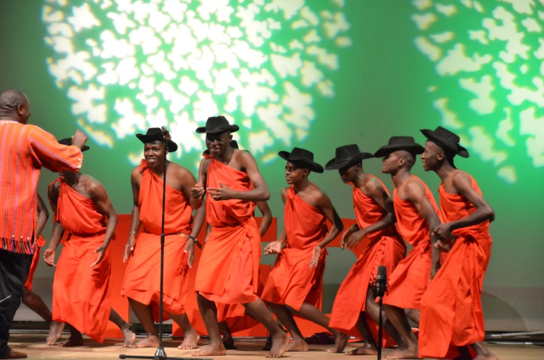 a number of people with hats on on stage