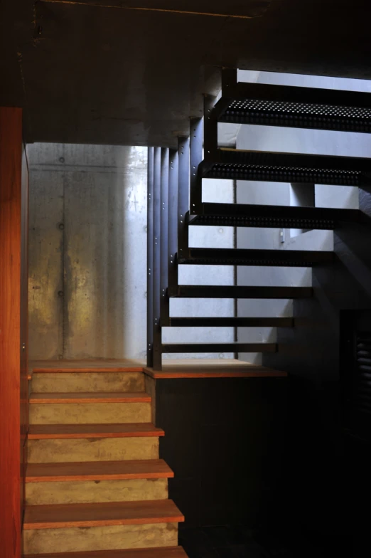 a room with wooden steps and steel railing