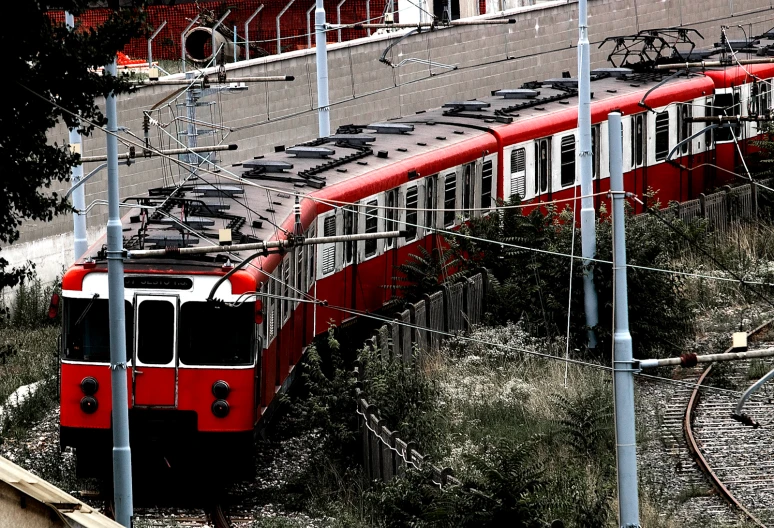 a train driving down tracks in front of buildings