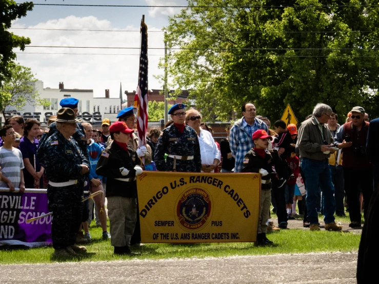 a group of people holding signs and flags