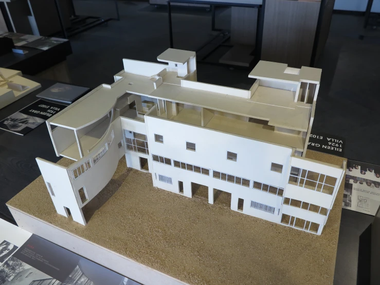 the paper model of a two story house is on display