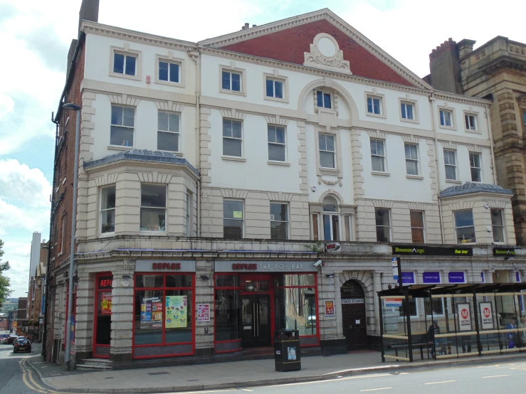 a large tan building with many windows on top