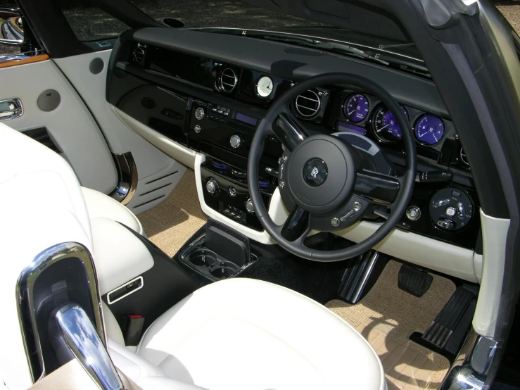 a car dashboard with white cloth on top and beige leather around it