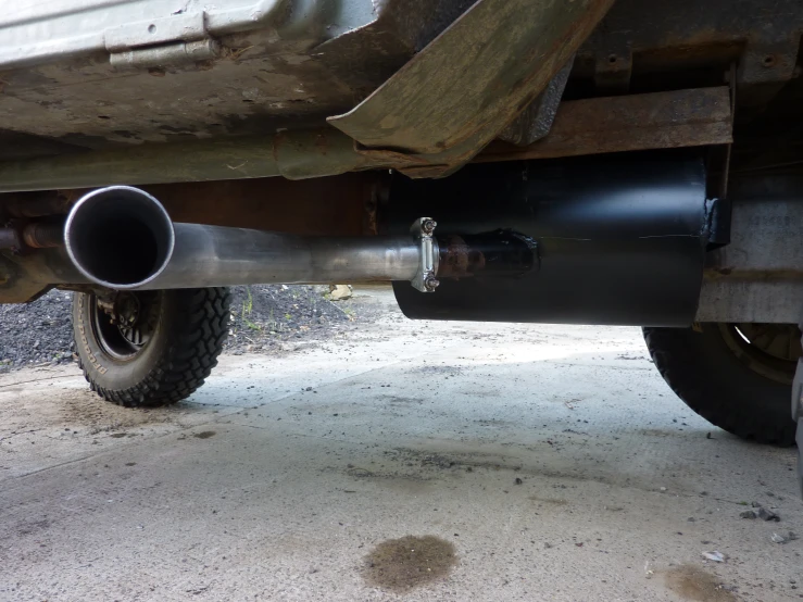closeup of metal pipe on underside of truck