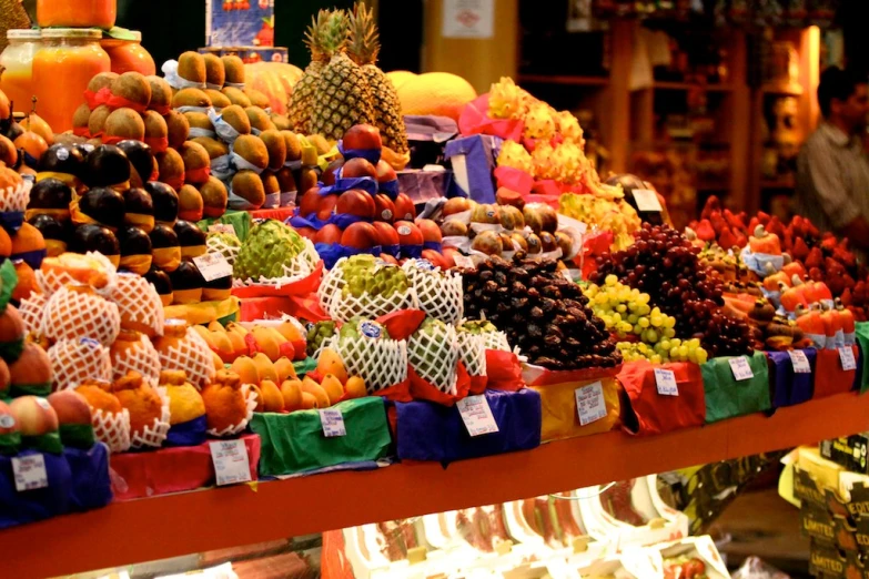 an open market with lots of fruits in a basket