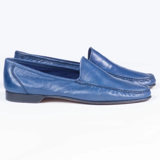 a women's blue loafer that has been made into a slip on