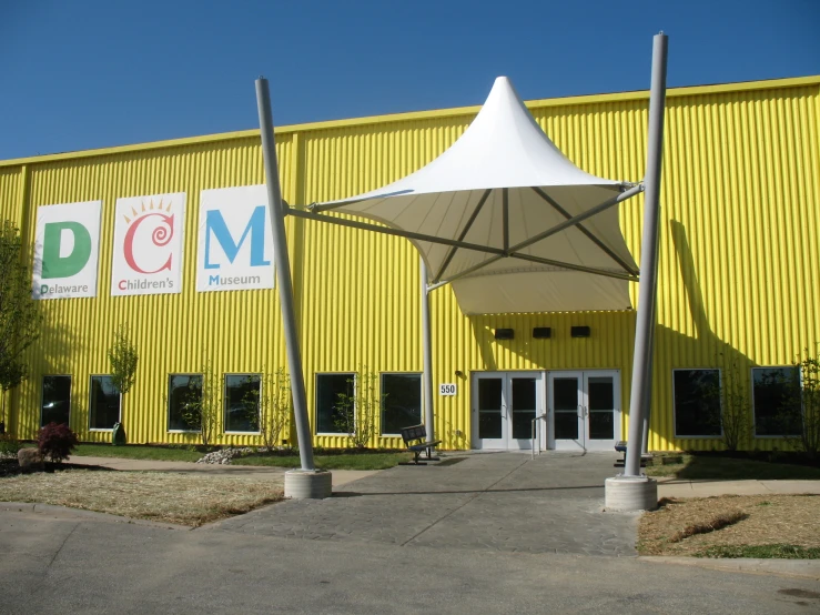 a building with a white umbrella in front of it