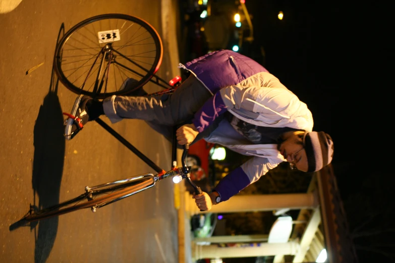 a man is riding his bike down the street