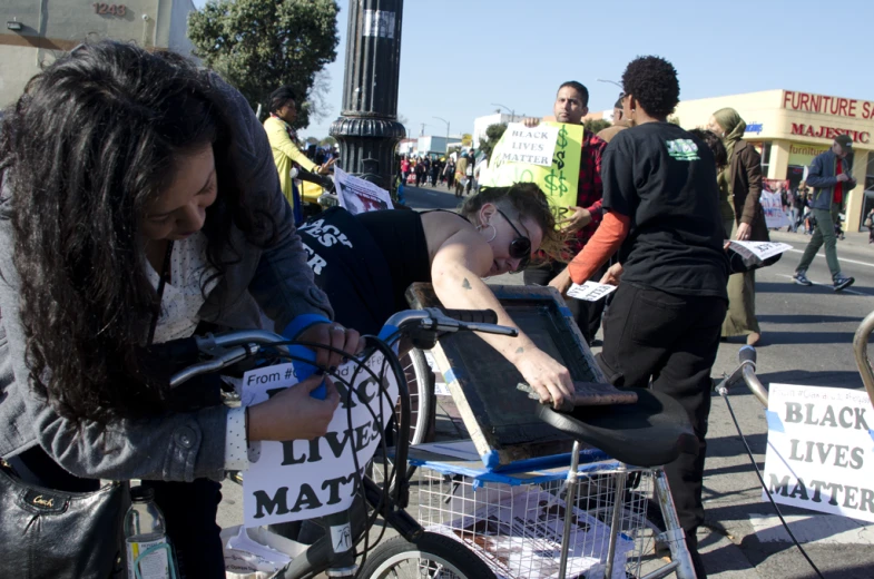 there is a protest in which people are being put on a bike