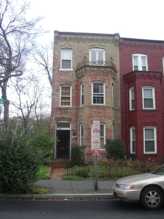 a very old building on a corner by the street