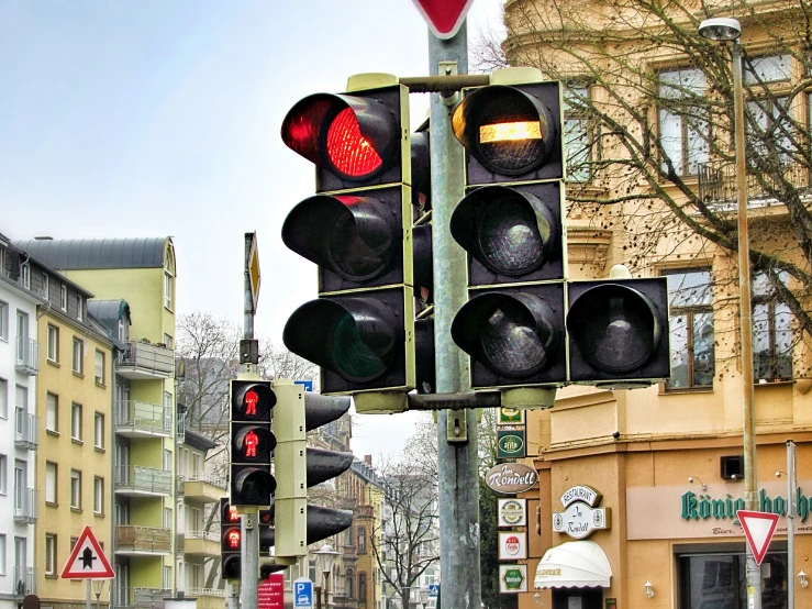 a couple of traffic lights on a pole