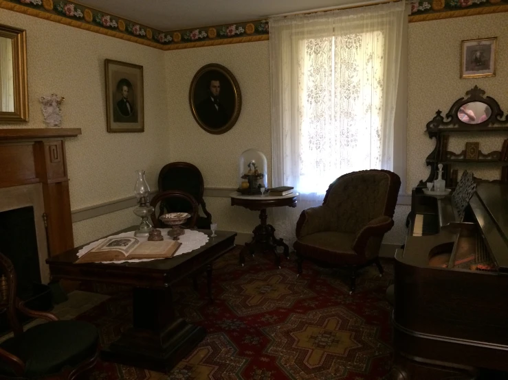 there is an older house living room with antique furniture