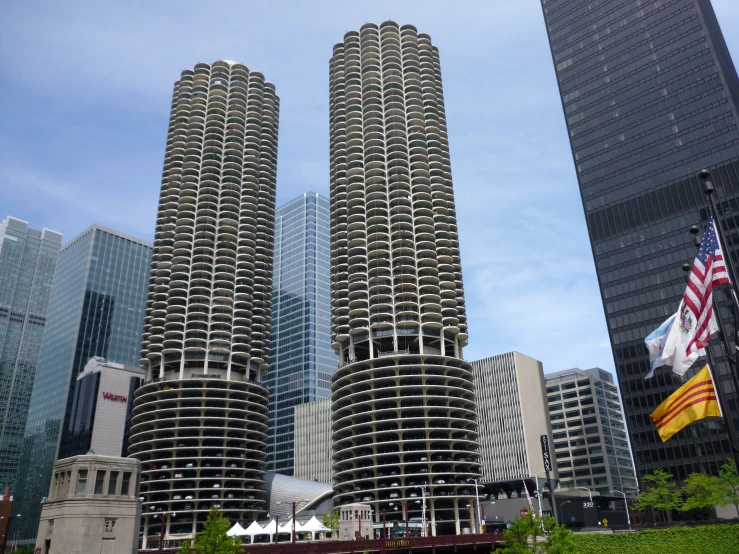 tall buildings stand in the city beside other large buildings