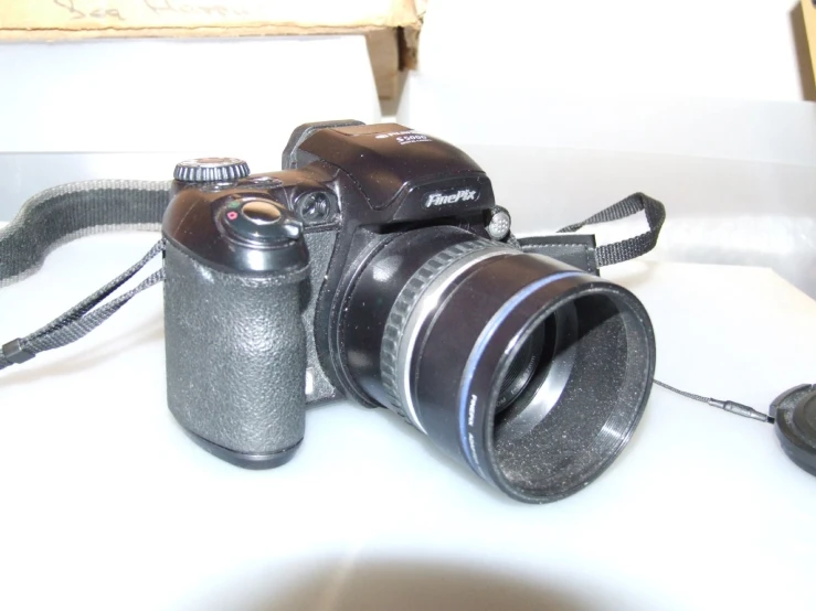 a camera is set on top of the table with a light attached