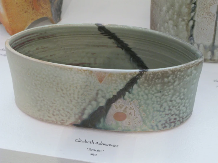 a close up of a white bowl on a table