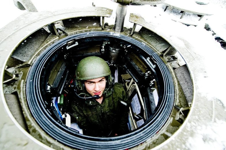 a female soldier in uniform in a machine room