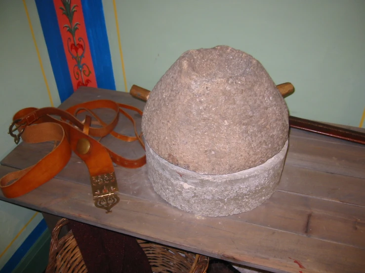 a wooden table with two different colored purses on top