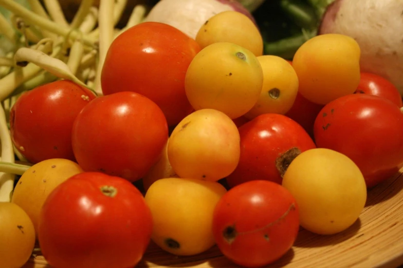 tomatoes, onions and broccoli are shown on a plate