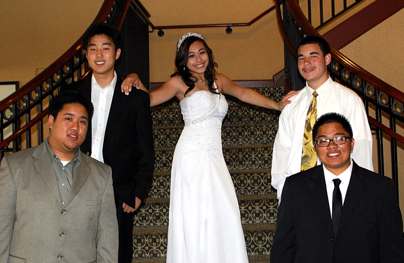 the man is posing next to his bride