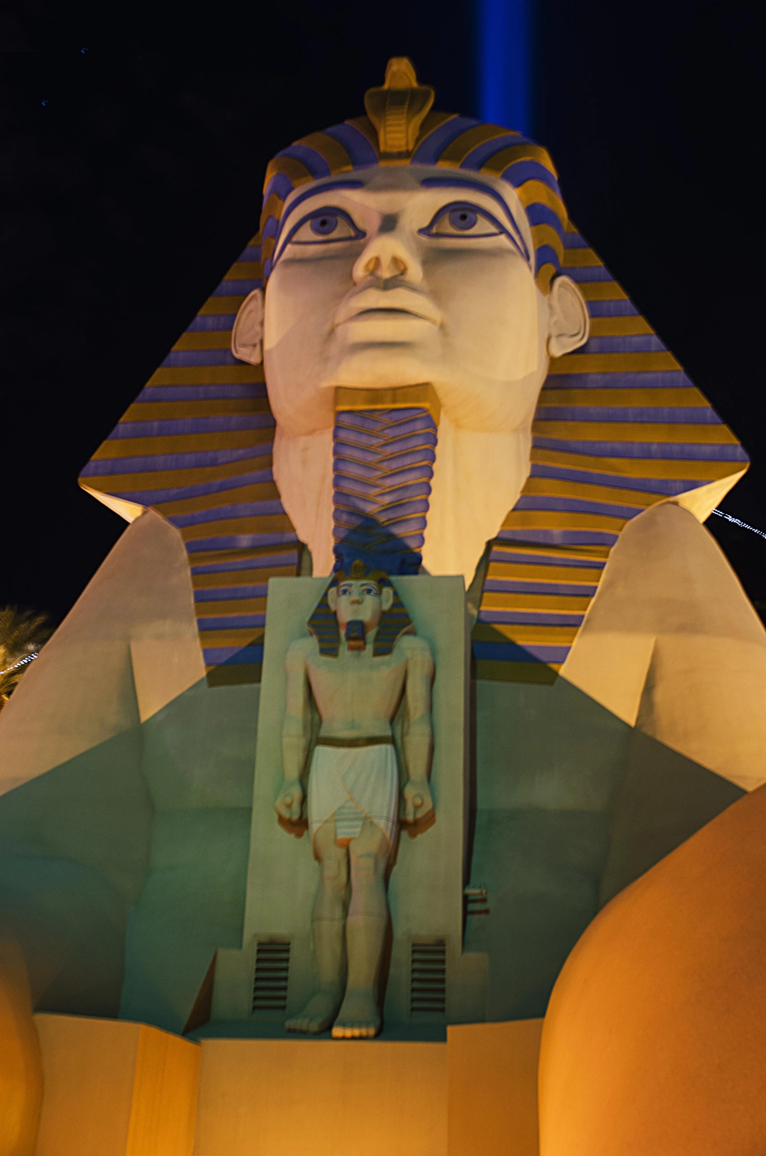 a po taken at night shows a statue of an egyptian pharaoh with a sphinx head