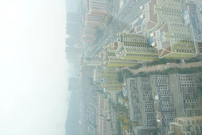 an aerial view of a city with large buildings