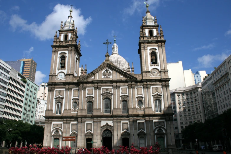 a beautiful church that's surrounded by high rise buildings