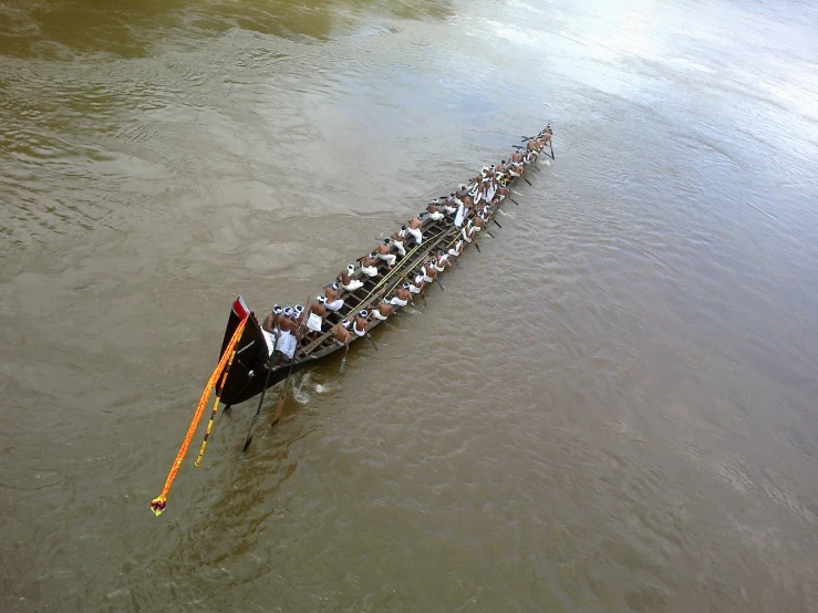 an aerial view of people on the boat going down the river