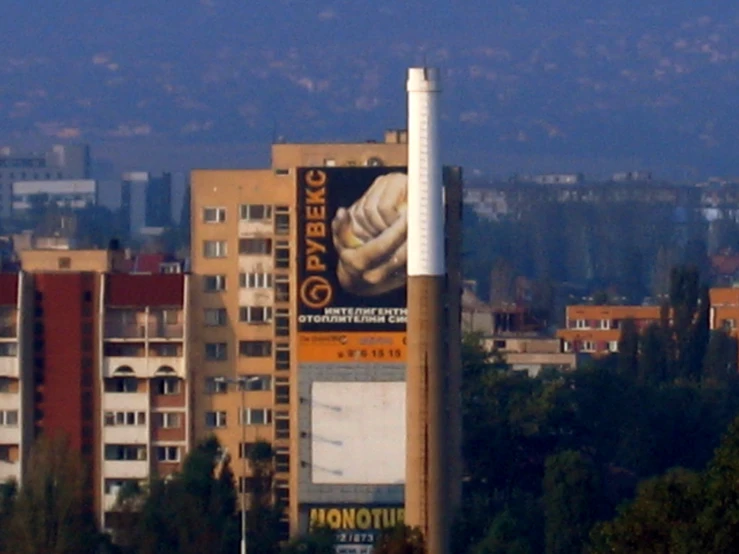 a large billboard on the side of a building in a city