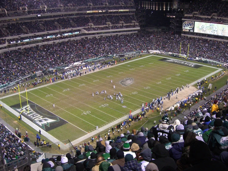 the stadium is packed with fans for a football game