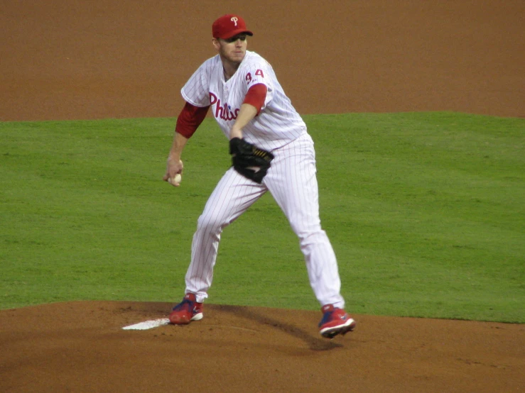 baseball player in uniform about to throw the ball