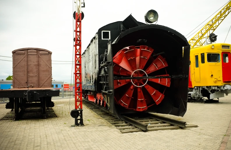 train engine with wheel on display in outdoor station