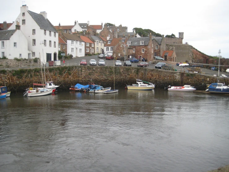 there are some boats parked near the shore