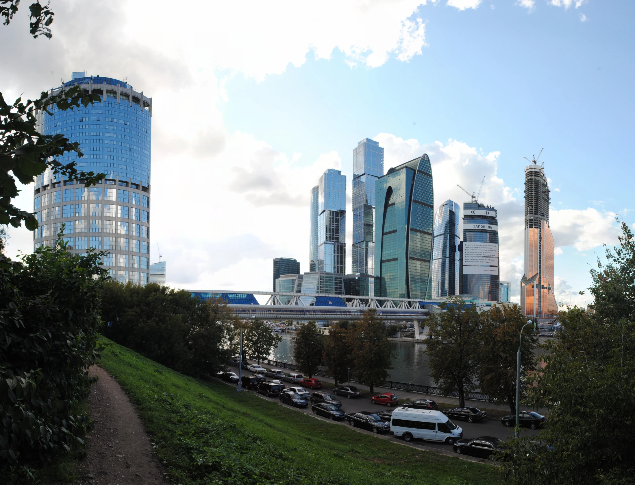 the city is full of tall skyscrs on a sunny day