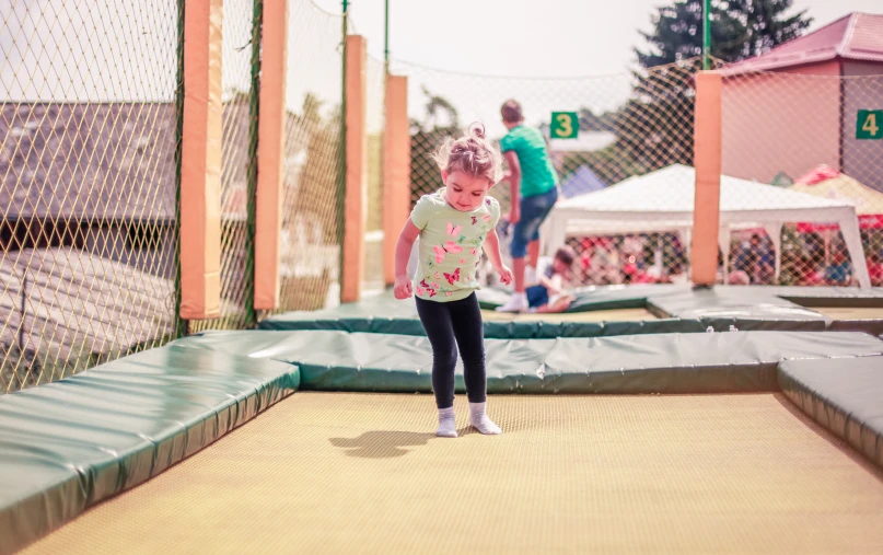 a  is practicing her tricks in a trampoline park