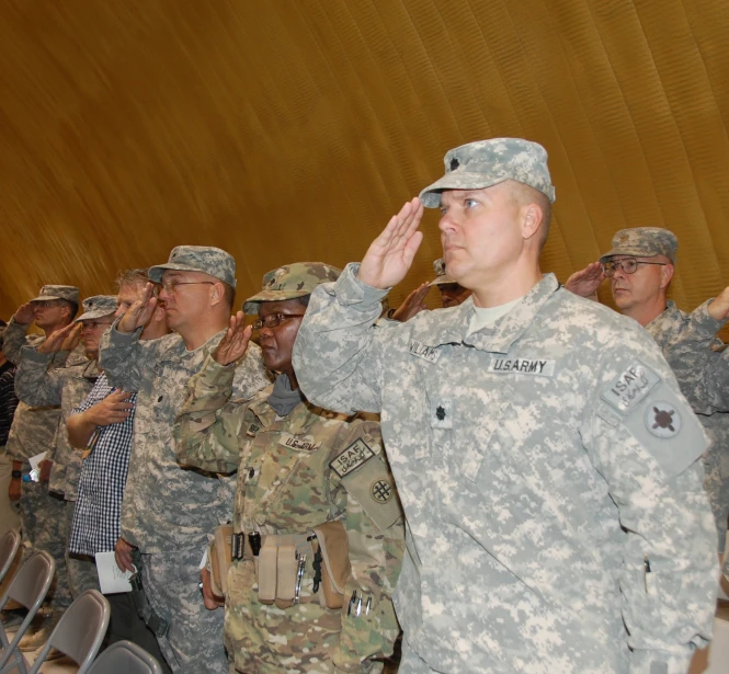 a group of soldiers in a long line clapping