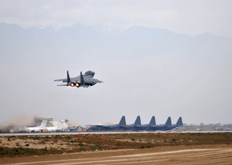 a jet plane taking off with smoke coming from it