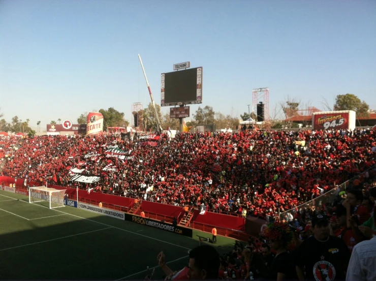 a large crowd of people in the stands at a soccer game