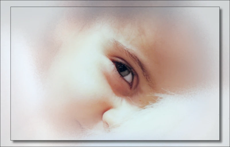 an extreme close - up of a mans eye and fur