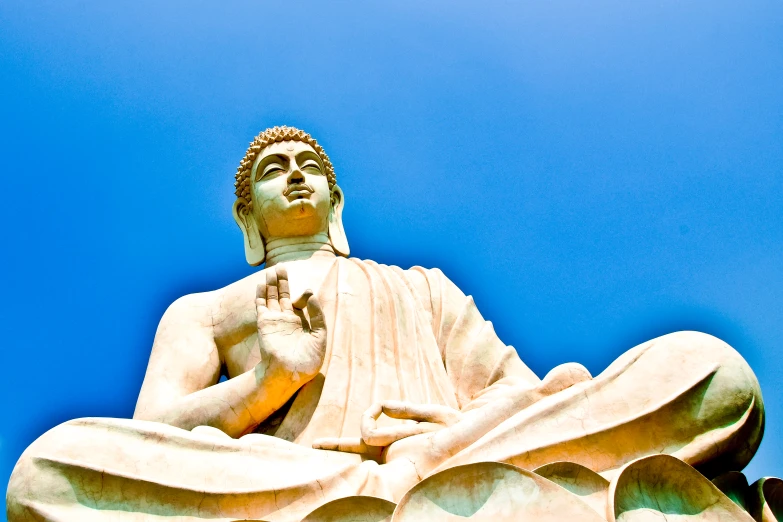 an image of a buddha statue sitting on the floor