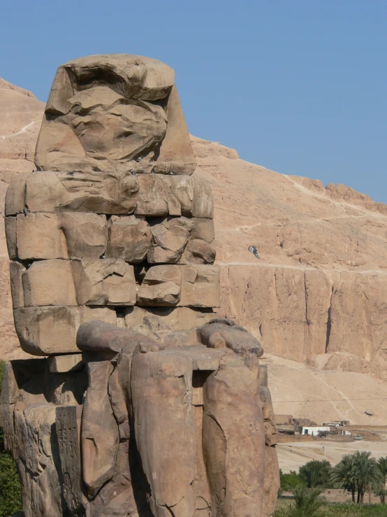 large sculptures of elephants are displayed in the desert