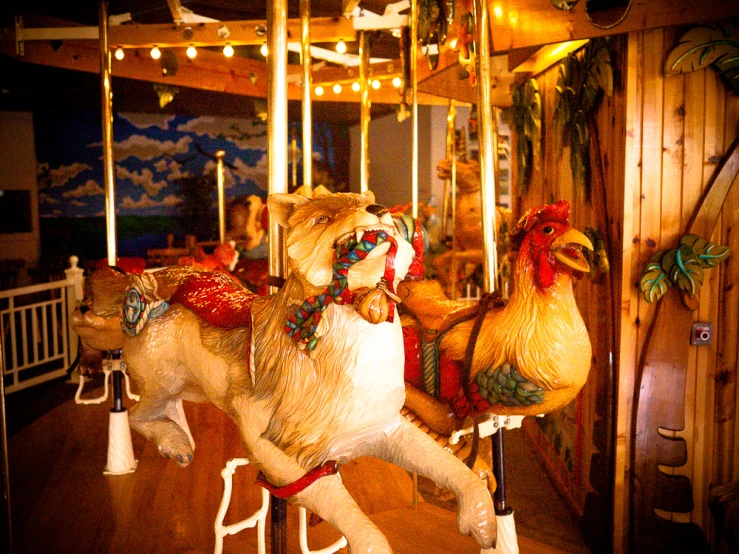 a close up of a merry go round with animals