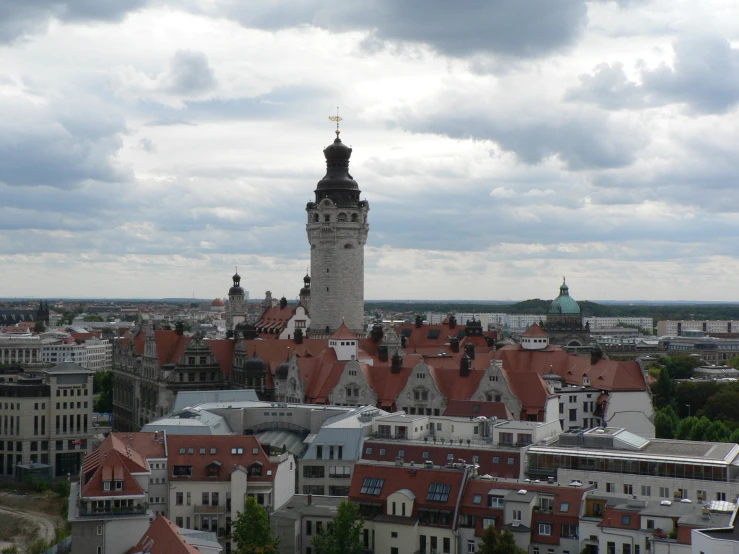 there is a clock tower with the lights on and the sky in the background