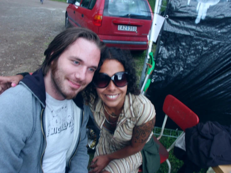 a couple taking a selfie at an outdoor event