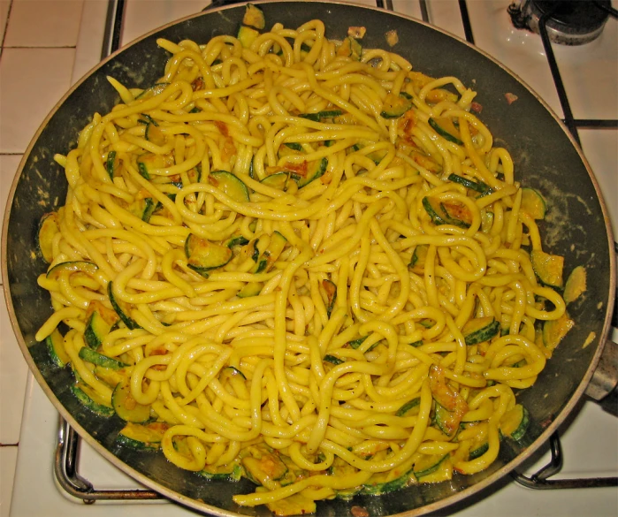 a close up of a pasta dish on a stove top