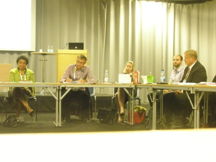 panel discussion at a conference with many people