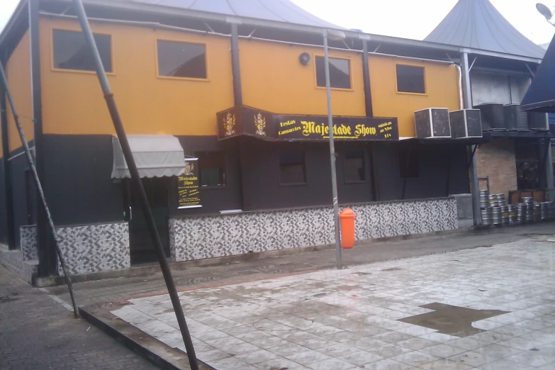 a yellow building with a bunch of windows