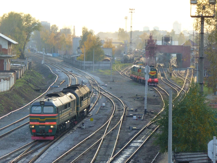 two train tracks with three trains on one of them