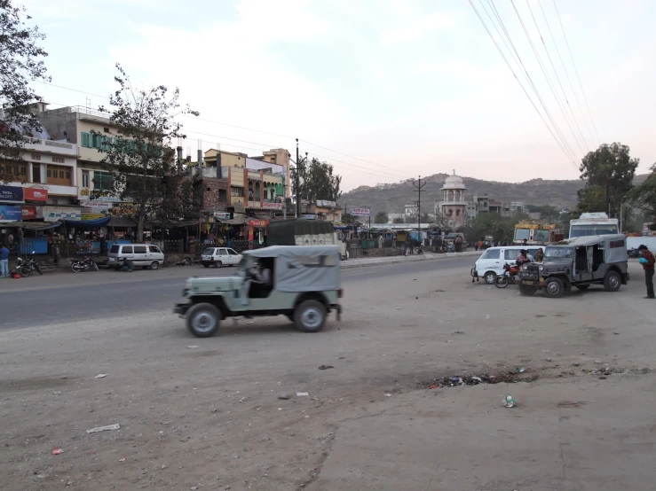 a jeep driving down the middle of a street