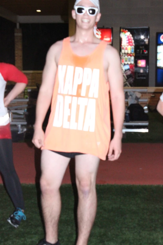 a man wearing shades and a tank top that says vappa deitta